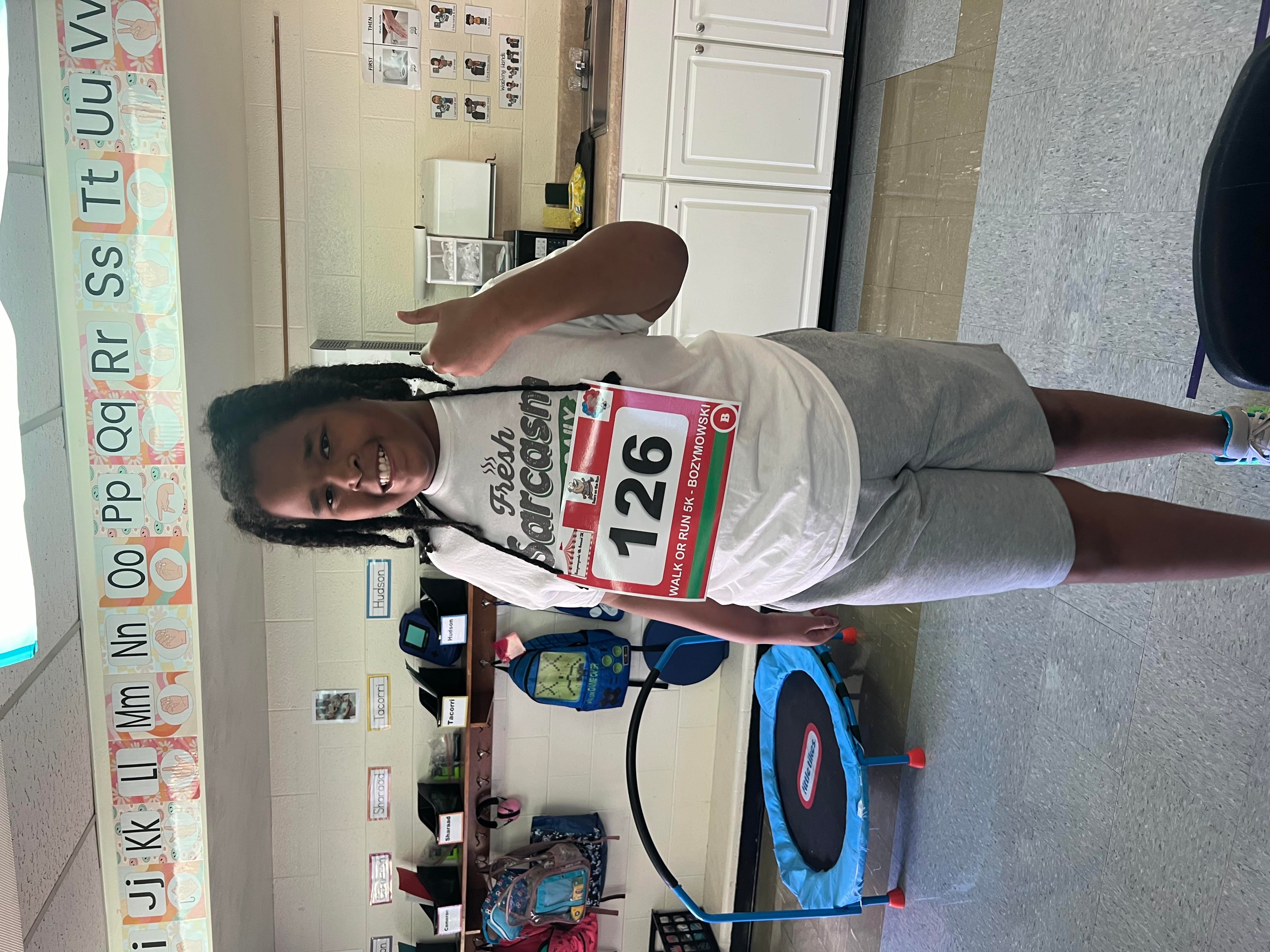 Student image with thumbs up